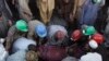 Pakistani mine workers carry out the body of a colleague from a coal mine in Dasht, 35 kilometers (22 miles) north of Quetta, Pakistan on Thursday, Oct 13, 2011. Five miners were killed and many more were trapped as the mine collapsed after gas caused ex